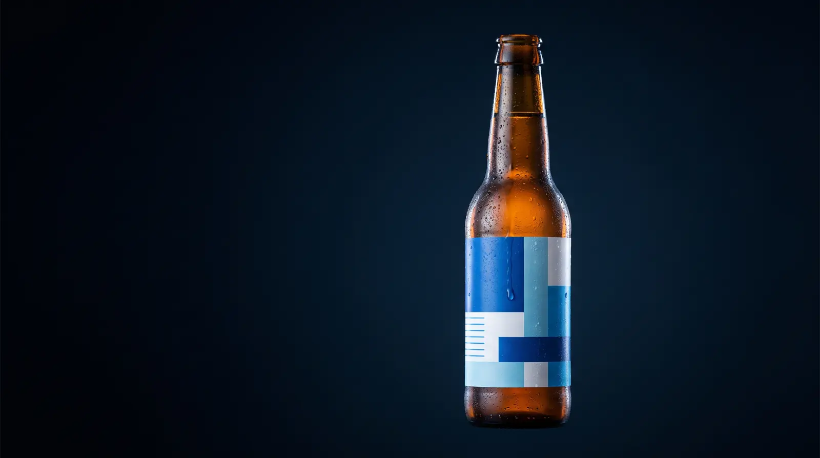 A chilled bottle beaded with condensation, its laminated label unaffected